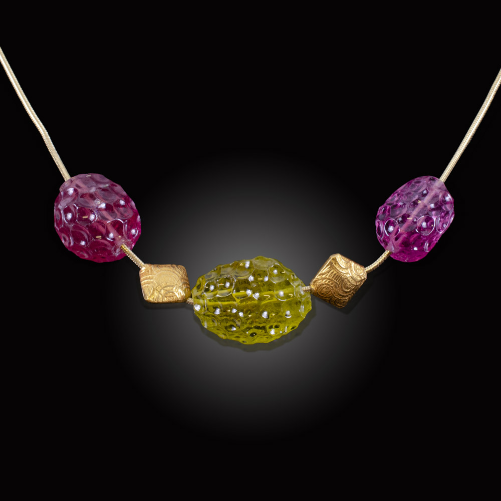Yellow gold necklace with carved pink and Yellow Tourmaline bead and gold beads
