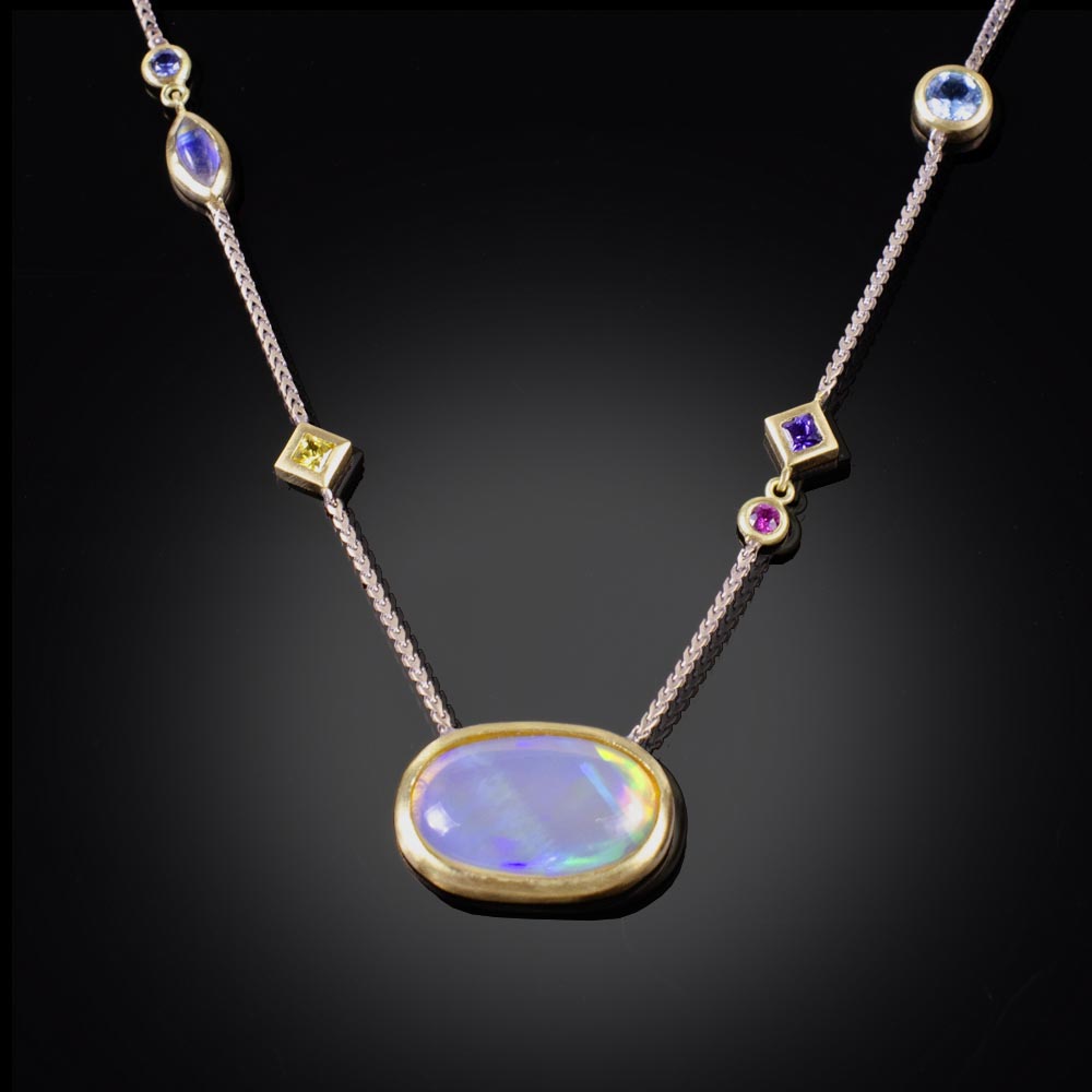 18K brushed yellow and white gold necklace with bezel set Ethiopian Opal, pink, yellow, purple and blue Sapphires and a Moonstone
