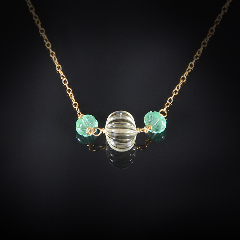 18K yellow gold necklace with carved yellow Quartz and Emerald beads