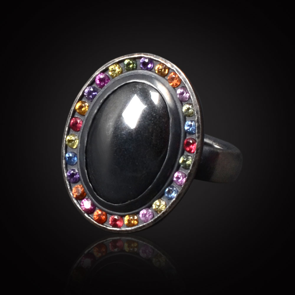 Oxidized sterling silver ring with Hematite surrounded by multicolor Sapphires